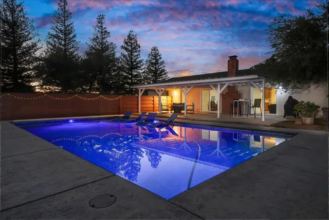 a view of a house with swimming pool