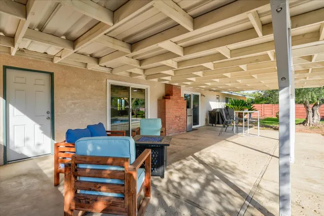a outdoor living space with patio furniture and potted plants