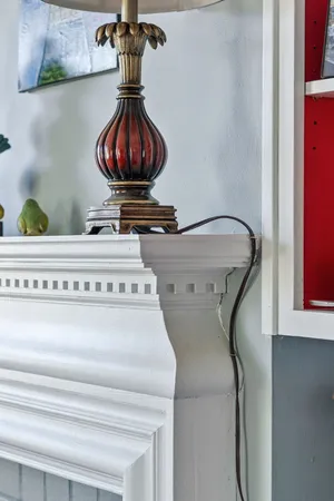 a view of a dining room with furniture a chandelier and a window