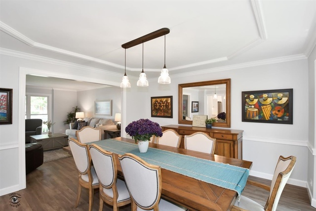 1536 Carlyle Road Naperville, IL 60564 - Photo 20 of 65 a view of a dining room with furniture and chandelier