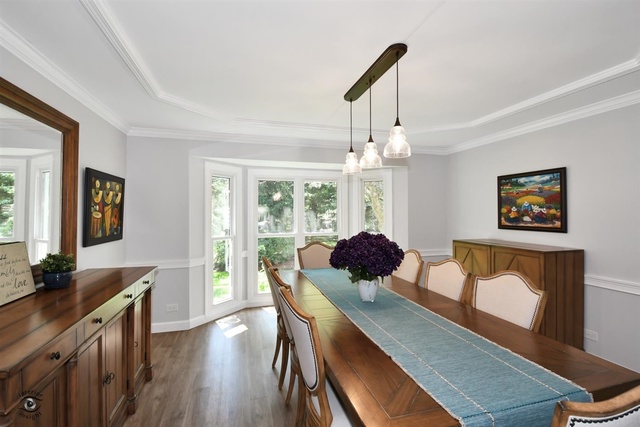 1536 Carlyle Road Naperville, IL 60564 - Photo 21 of 65 a view of a dining room with furniture window and wooden floor