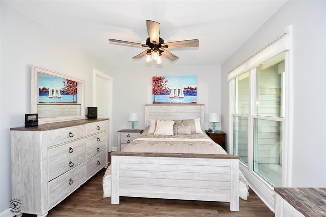 1536 Carlyle Road Naperville, IL 60564 - Photo 25 of 65 a bedroom with a bed and a chandelier