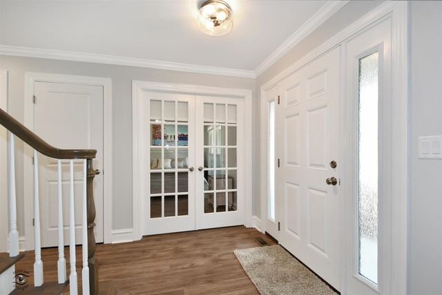 1536 Carlyle Road Naperville, IL 60564 - Photo 28 of 65 a view of an entryway with wooden floor