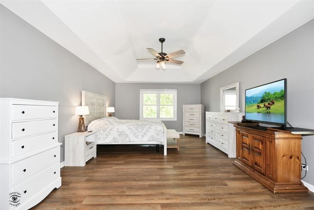 1536 Carlyle Road Naperville, IL 60564 - Photo 29 of 65 a bedroom with a bed and a flat screen tv
