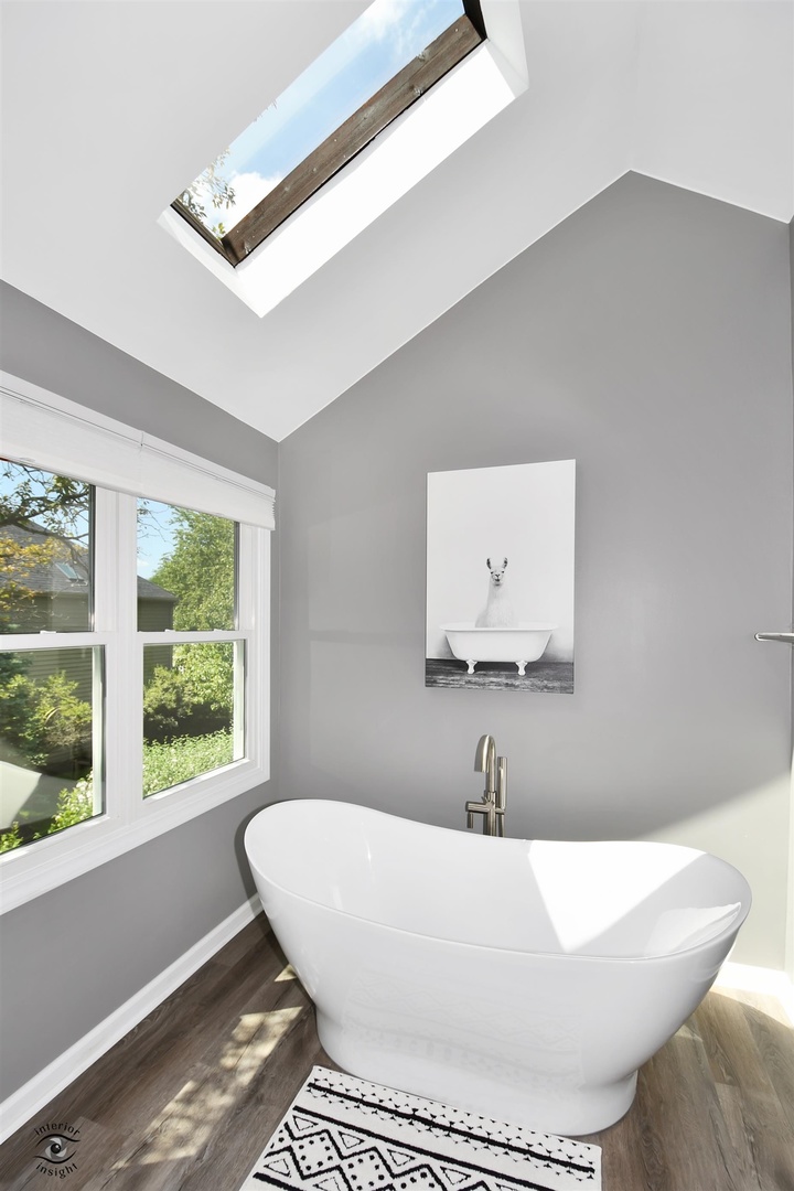 1536 Carlyle Road Naperville, IL 60564 - Photo 32 of 65 a white bath tub sitting in a bathroom next to a window
