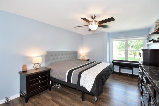 1536 Carlyle Road Naperville, IL 60564 - Photo 35 of 65 a bedroom with a bed and a window