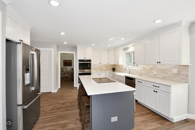 1536 Carlyle Road Naperville, IL 60564 - Photo 7 of 65 a kitchen with a sink stainless steel appliances and white cabinets