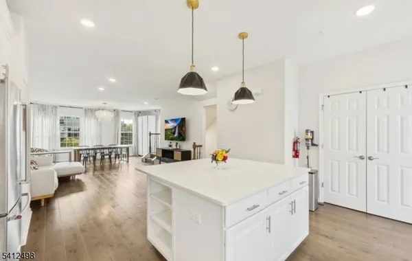 a view of a living room and kitchen