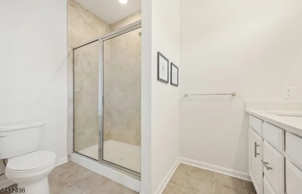 a bathroom with a shower and a toilet