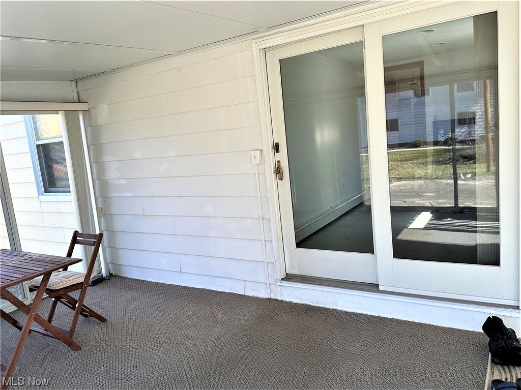 7440 Brecksville Road Independence, OH 44131 - Photo 13 of 23 Slider from the office to the sun porch