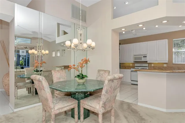 a living room with furniture a table and chairs