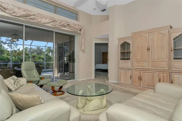 a kitchen with kitchen island a sink and a refrigerator
