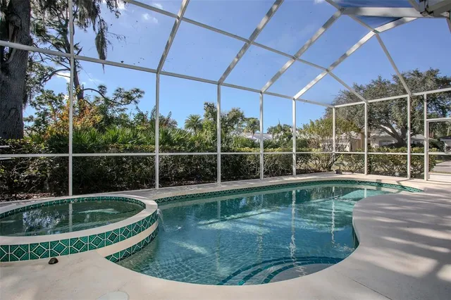 a view of swimming pool with a yard and seating area
