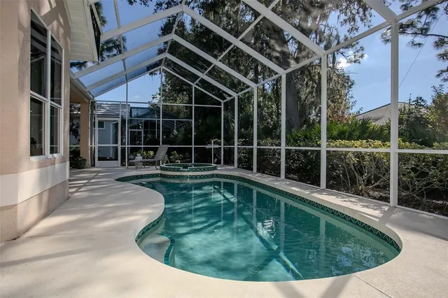 a view of a chair and tables on the roof deck