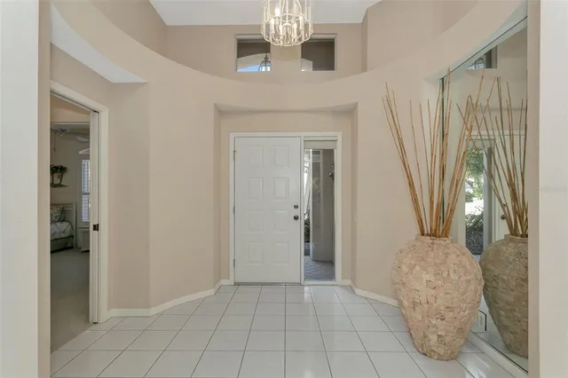 a spacious bedroom with a bed and a window