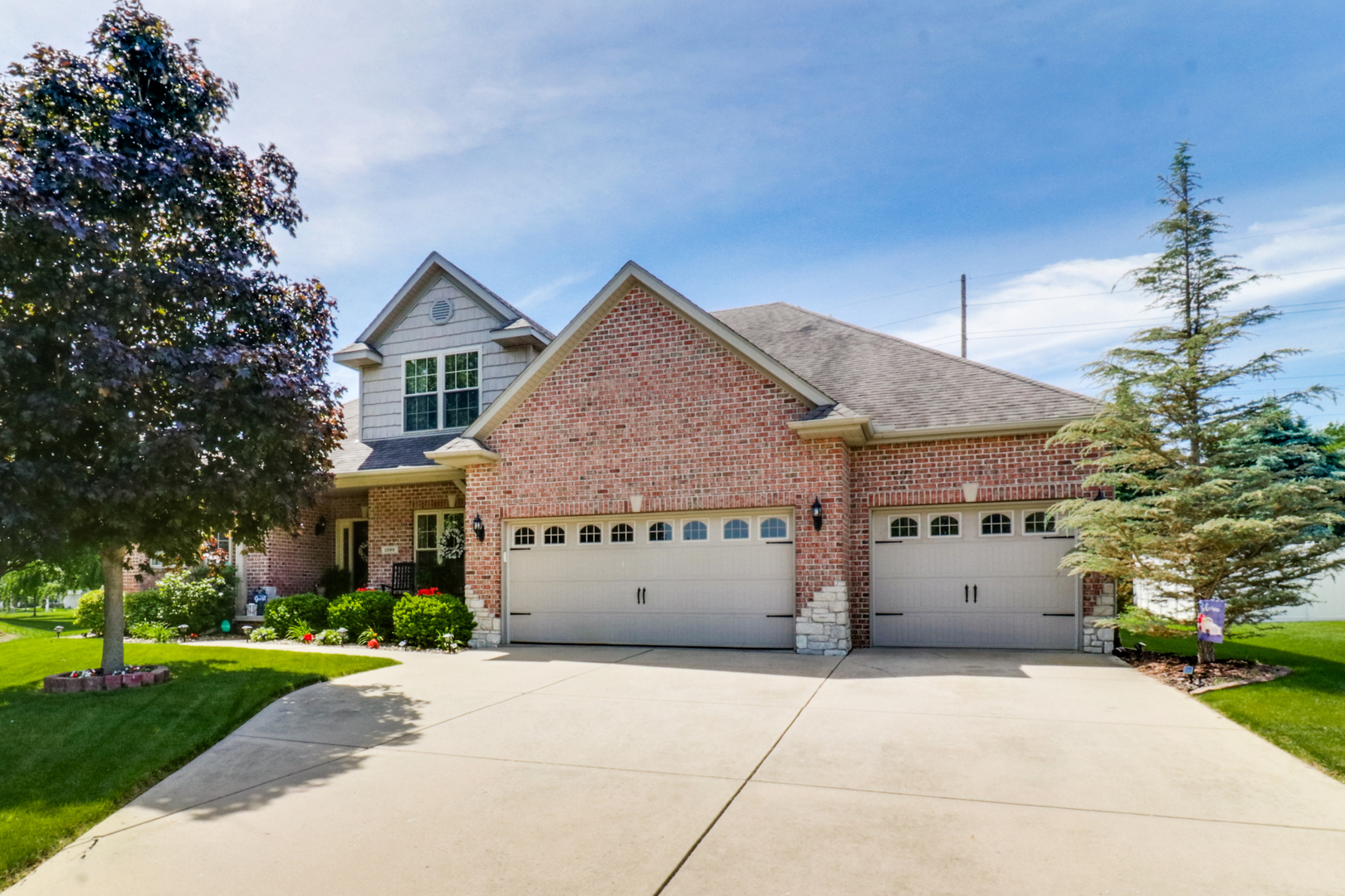 1099 Balsam Road Normal, IL 61761 - Photo 1 of 45 a front view of a house with a yard and a garage