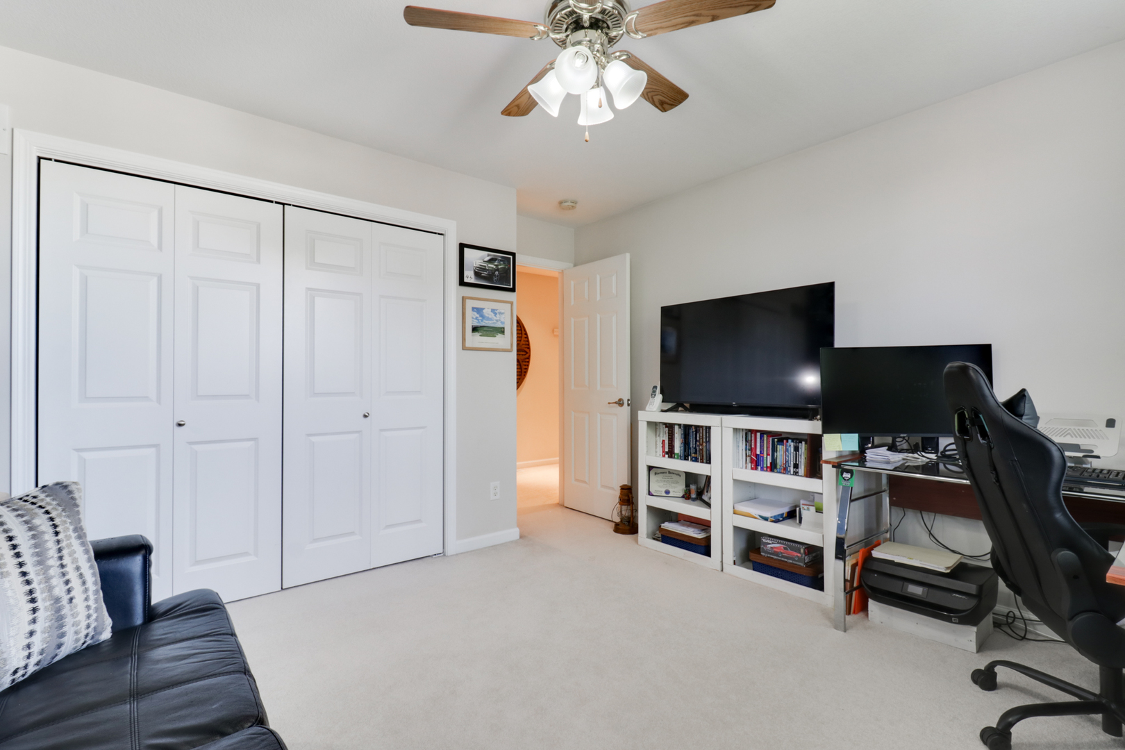 1099 Balsam Road Normal, IL 61761 - Photo 26 of 45 a view of a livingroom with furniture and a flat screen tv
