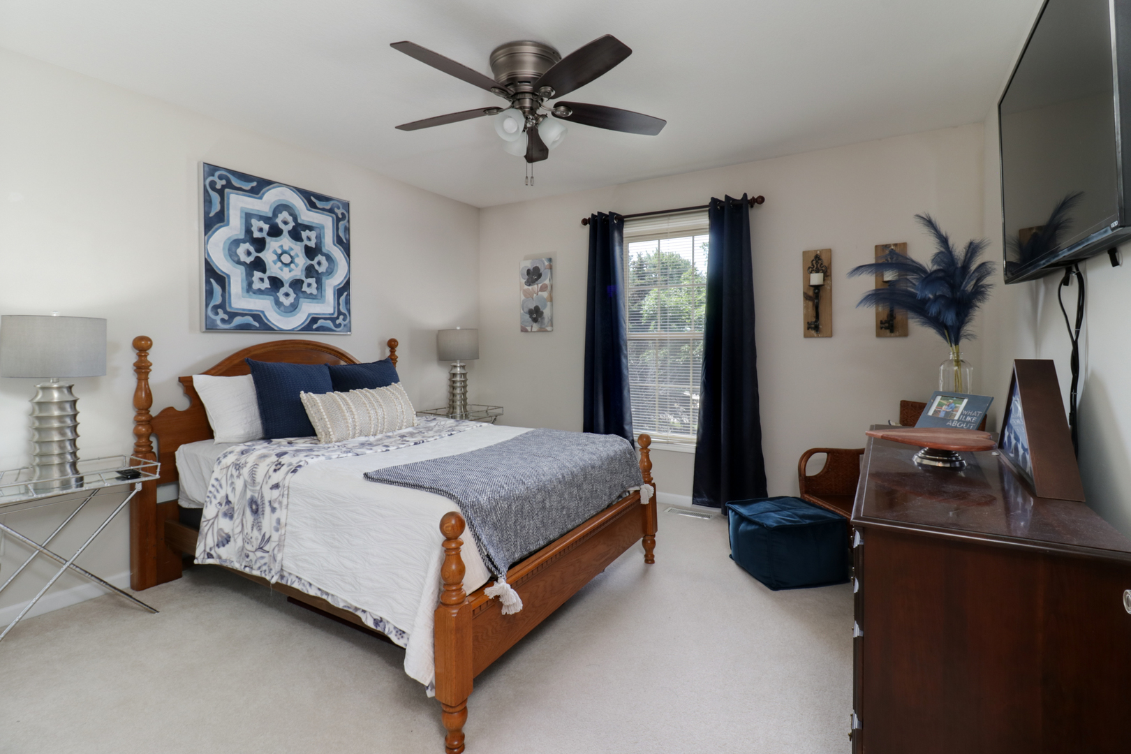 1099 Balsam Road Normal, IL 61761 - Photo 27 of 45 a bedroom with a bed flat screen tv and a chandelier
