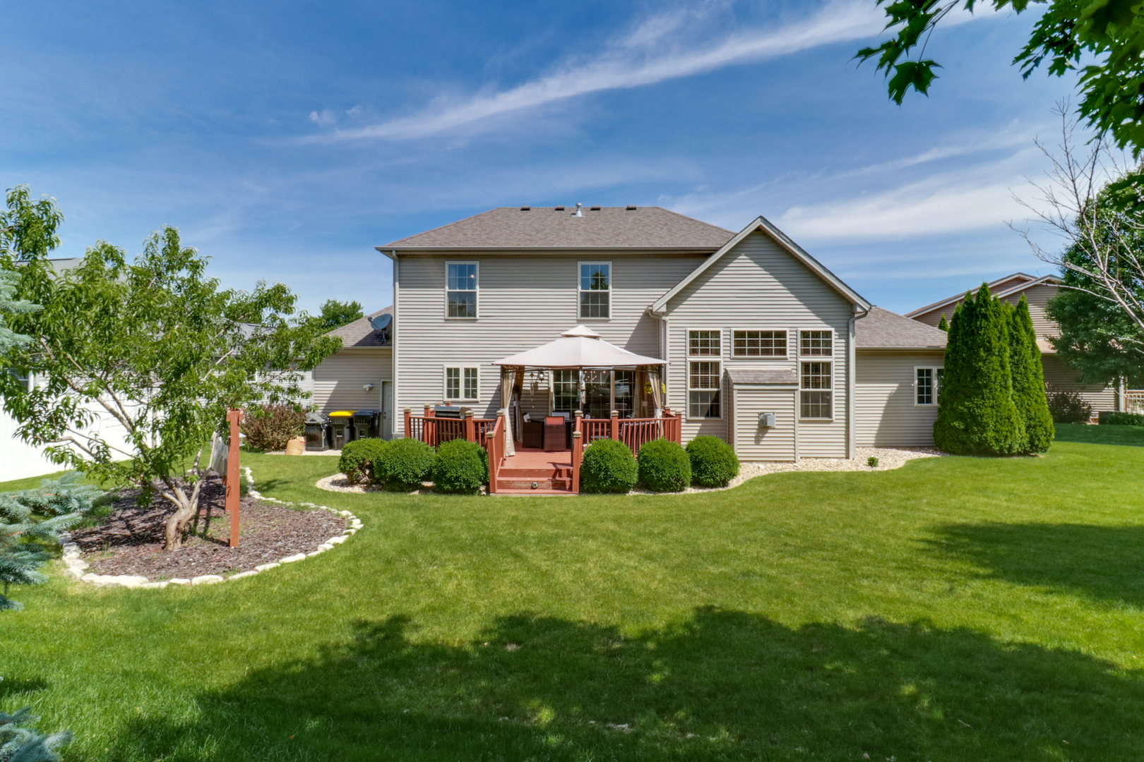 1099 Balsam Road Normal, IL 61761 - Photo 40 of 45 a view of a house with a big yard potted plants and large tree