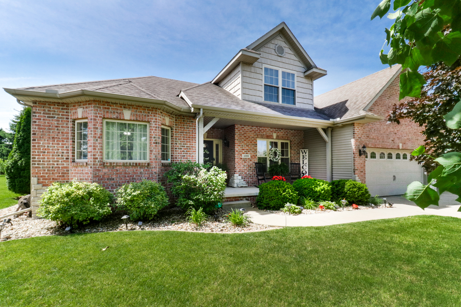 1099 Balsam Road Normal, IL 61761 - Photo 45 of 45 a front view of a house with a yard and potted plants
