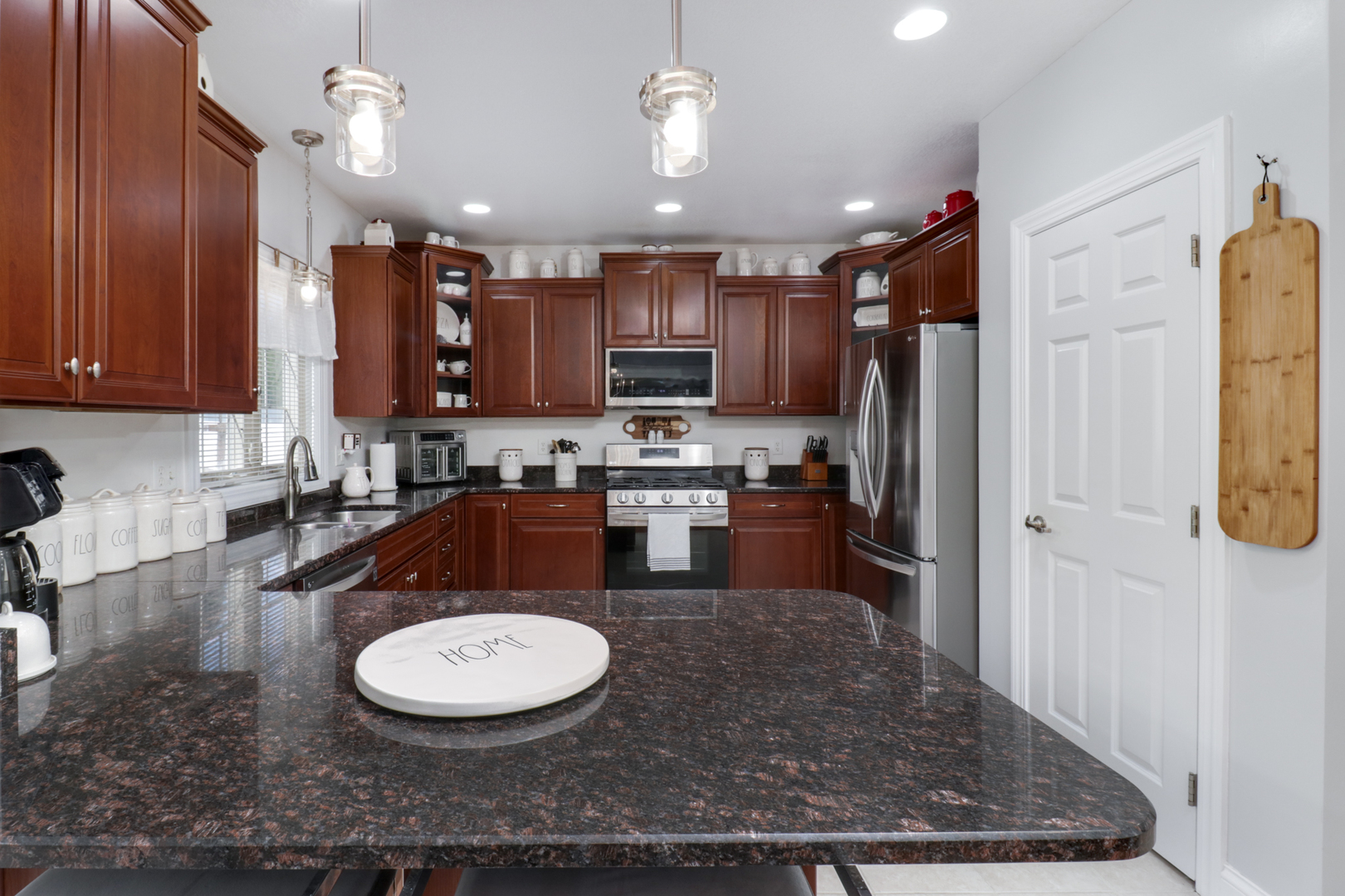 1099 Balsam Road Normal, IL 61761 - Photo 8 of 45 a kitchen with stainless steel appliances granite countertop a sink refrigerator and cabinets