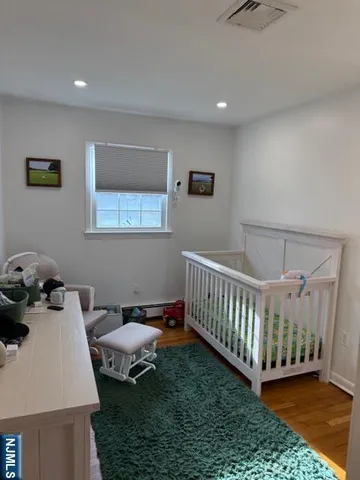 a bedroom with a bed and a table