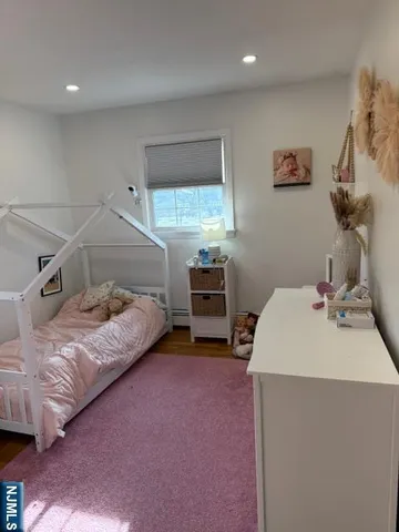a bedroom with a bed and a sink