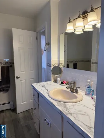 a bathroom with a sink and a mirror