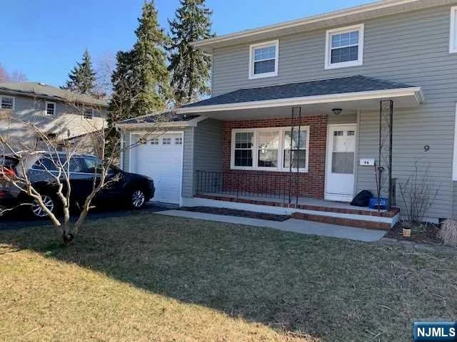 a view of a house with backyard