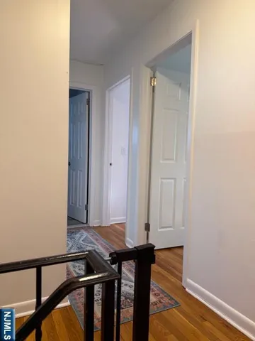 a view of an entryway with wooden floor