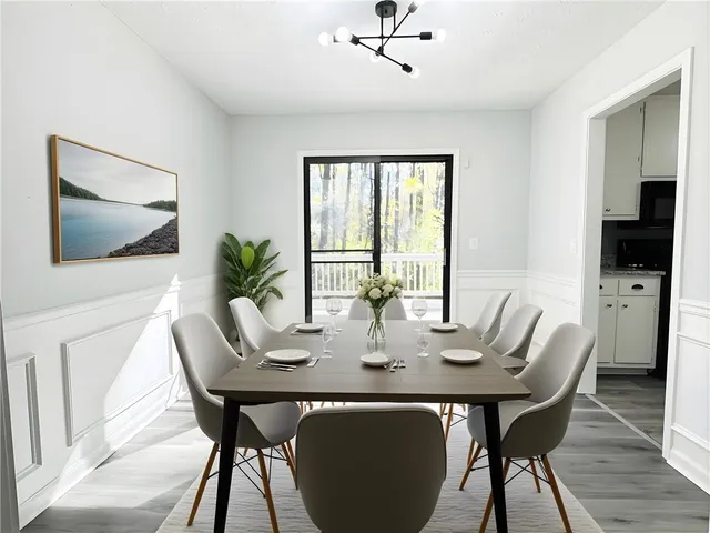 a view of a dining room with furniture window and wooden floor