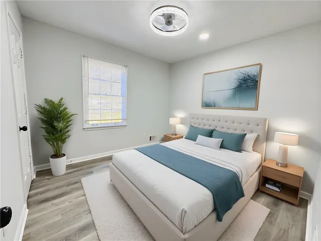 a bedroom with bed and a window