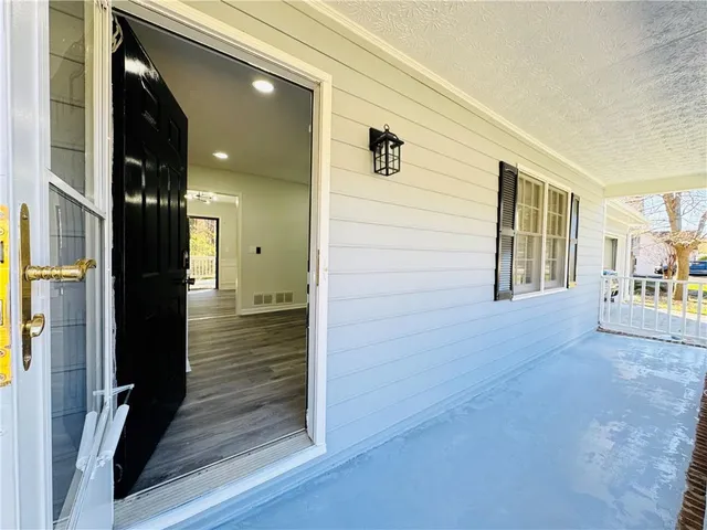 a view of livingroom with wooden floor and stairs