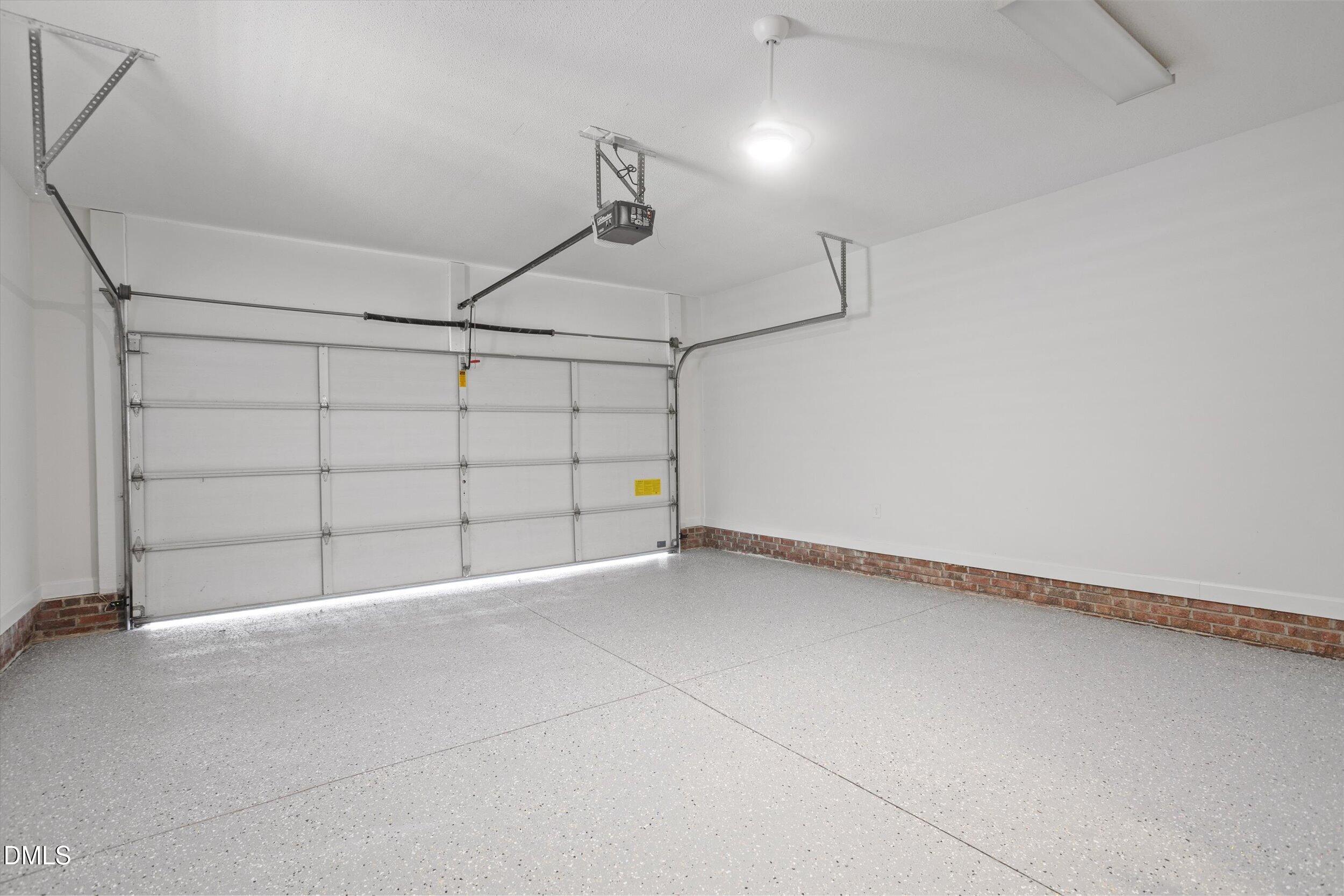 3417 Sir Colleton Court Raleigh, NC 27612 - Photo 45 of 46 2-Car Garage with sealed floor and storage cabinets