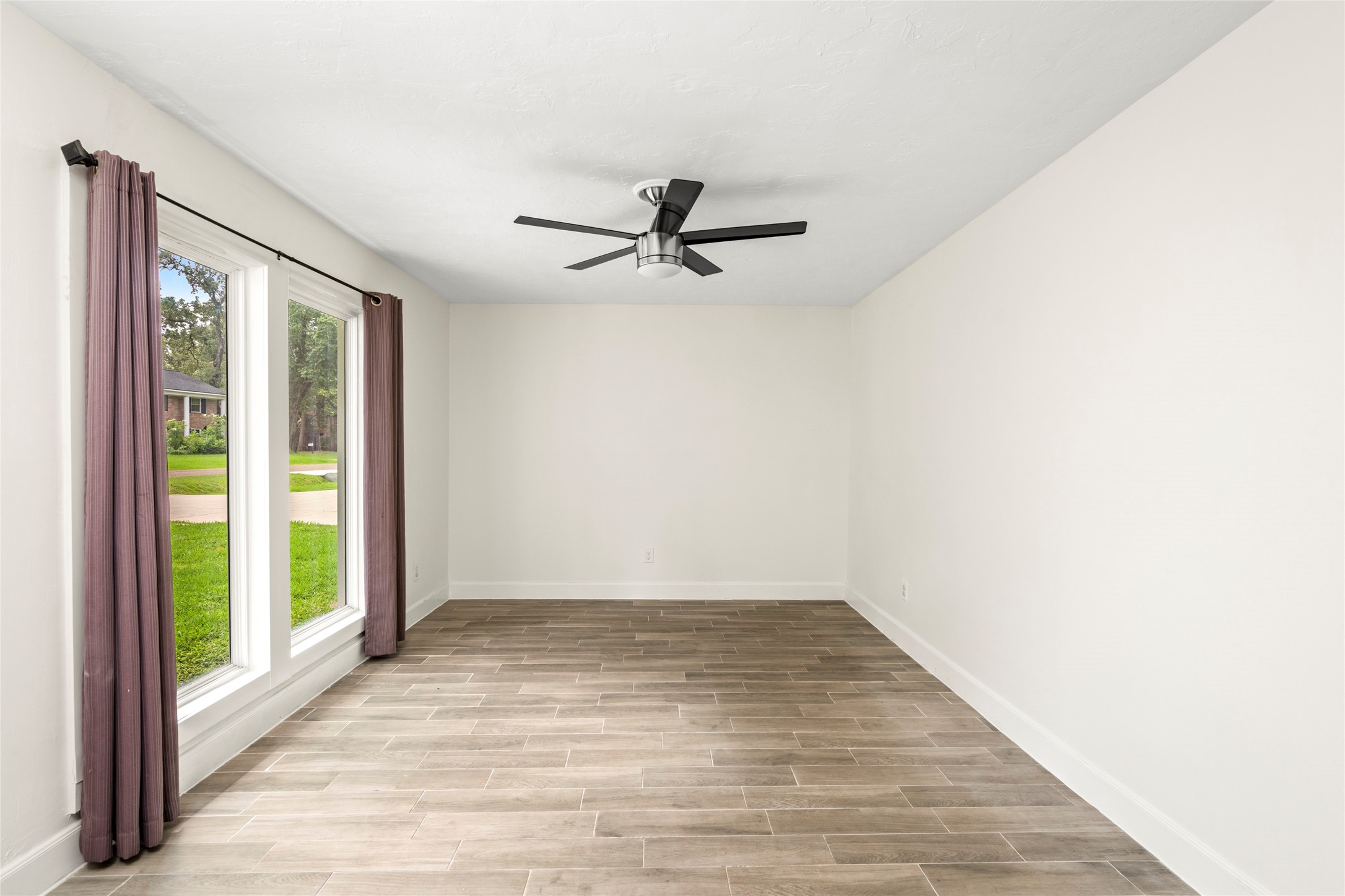 560 Landfall Lane Conroe, TX 77302 - Photo 12 of 41 The formal living room is on the main level and could serve as an office, playroom, or game room.