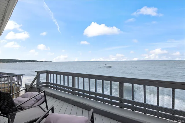 a view of a balcony with wooden floor