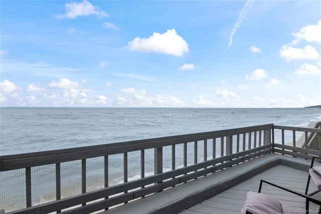 a balcony with wooden floor