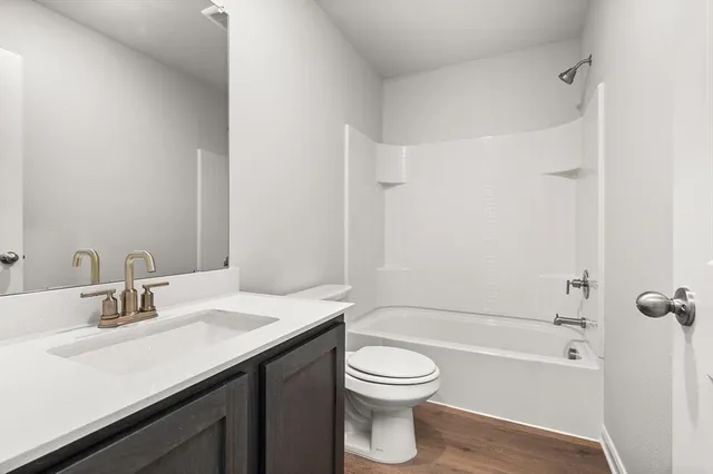 a bathroom with a sink a toilet and a bathtub