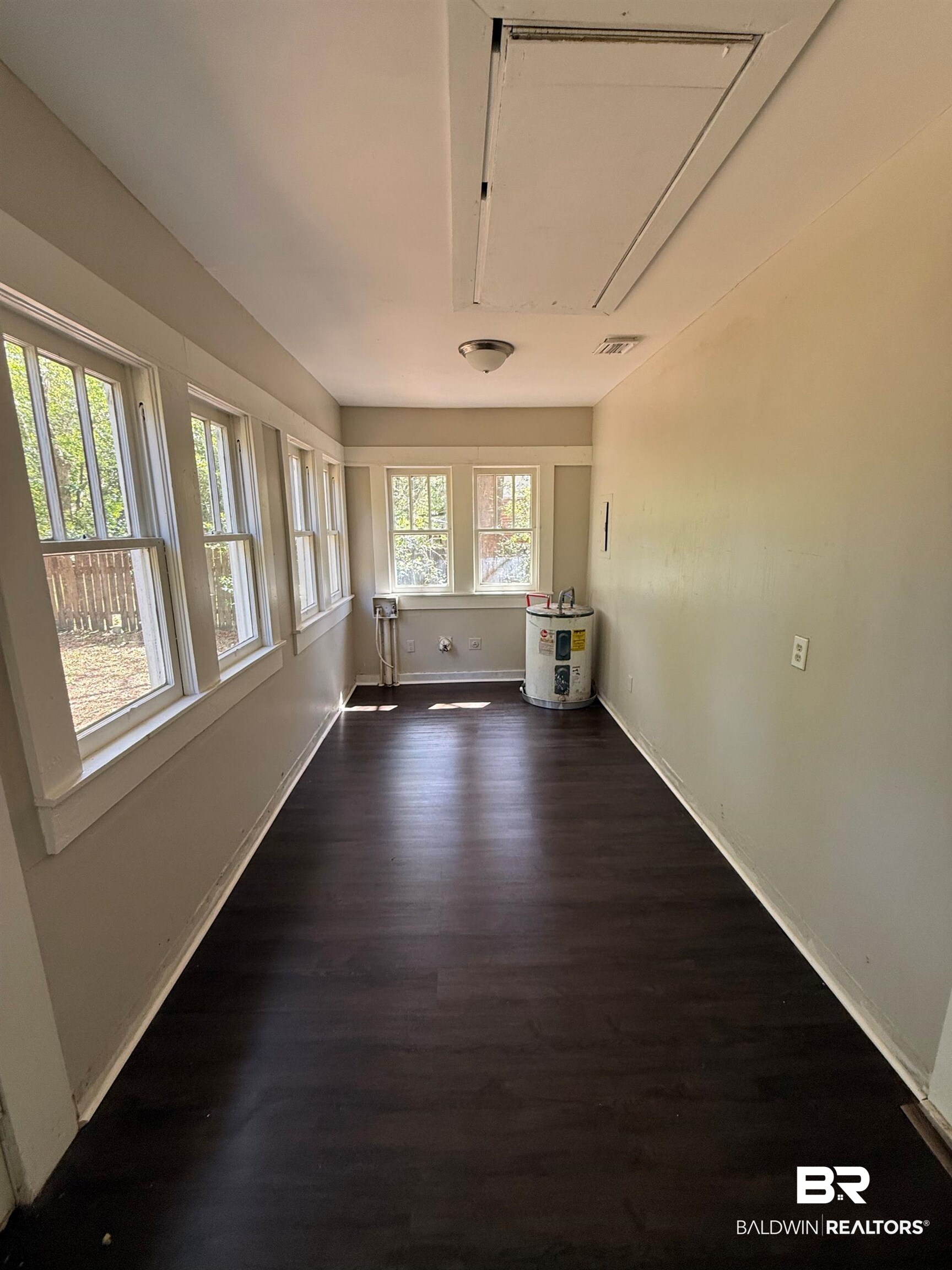655 Mandrell Street Mobile, AL 36606 - Photo 6 of 12 Unfurnished room with dark wood-style flooring and cooling unit