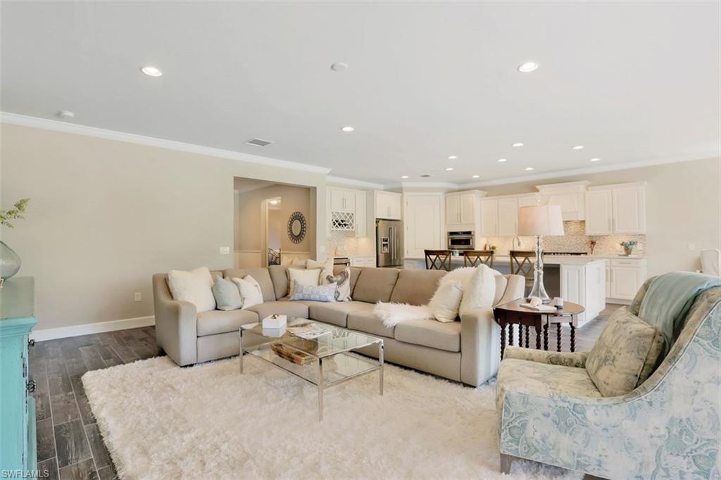 7005 Live Oak Drive Naples, FL 34114 - Photo 12 of 24 a living room with furniture and view of kitchen