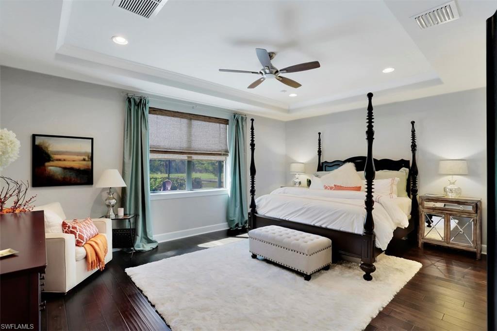 7005 Live Oak Drive Naples, FL 34114 - Photo 14 of 24 a bedroom with a bed and wooden floor