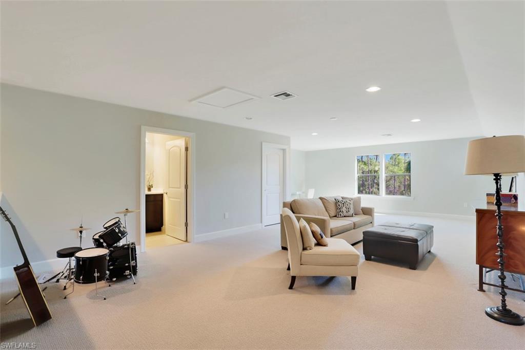 7005 Live Oak Drive Naples, FL 34114 - Photo 18 of 24 a living room with furniture and a couch