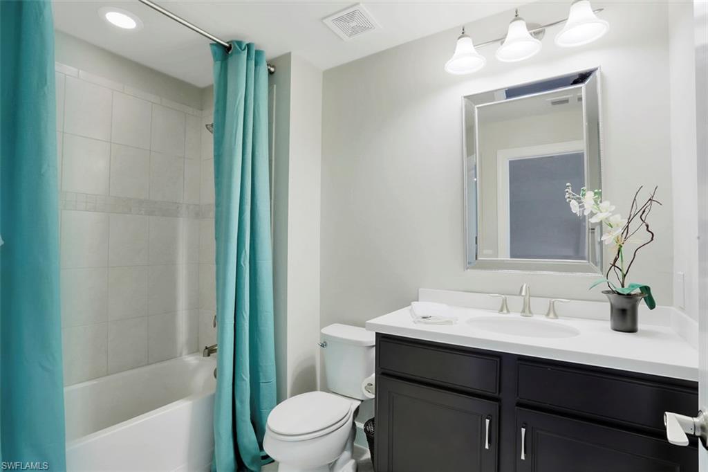 7005 Live Oak Drive Naples, FL 34114 - Photo 20 of 24 a bathroom with a sink a toilet and shower
