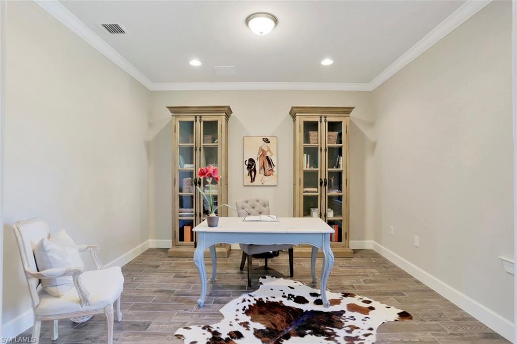 7005 Live Oak Drive Naples, FL 34114 - Photo 3 of 24 a living room with furniture and a potted plant