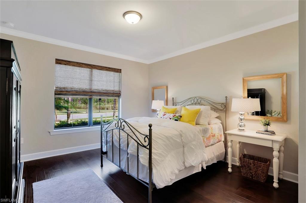 7005 Live Oak Drive Naples, FL 34114 - Photo 4 of 24 a bedroom with a bed next to a window with outer view