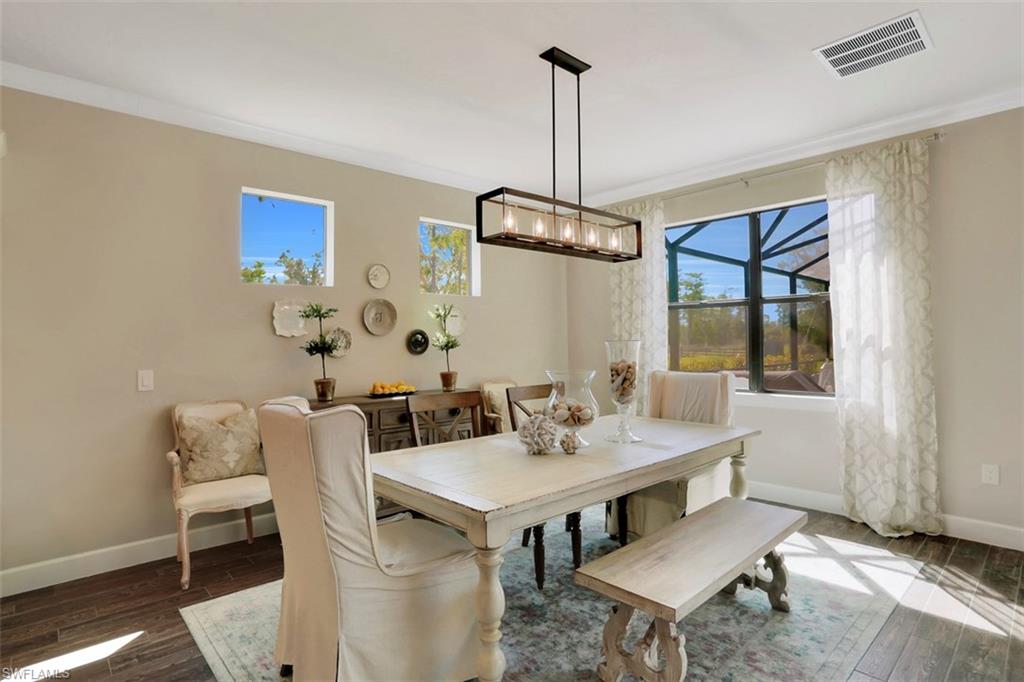 7005 Live Oak Drive Naples, FL 34114 - Photo 10 of 24 a view of a dining room with furniture