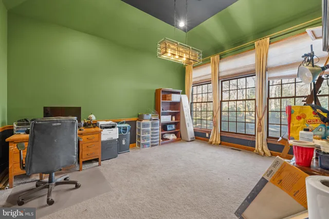 a view of game room with windows and air conditioner