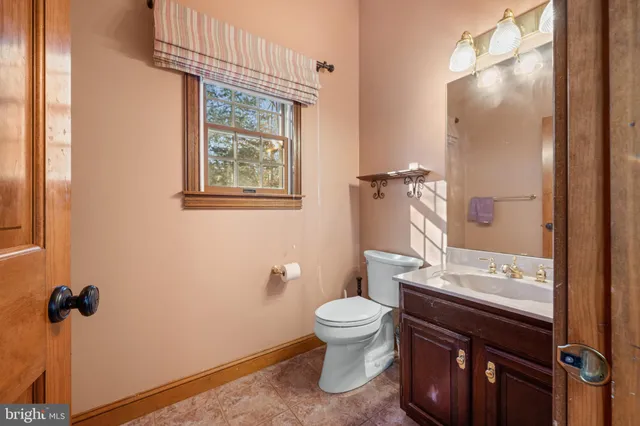 a bedroom with a bed and chair