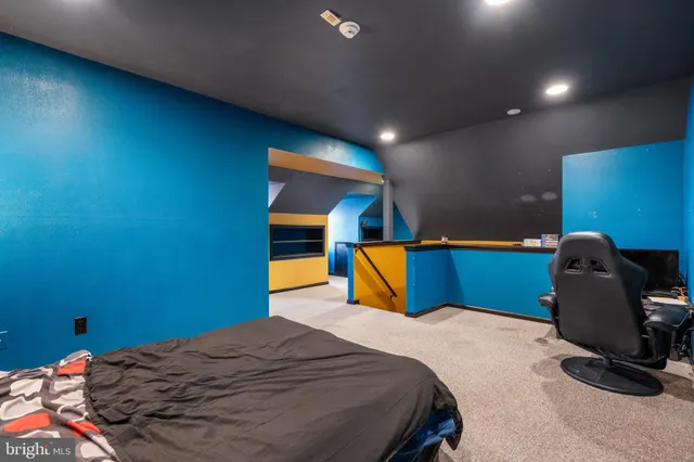 a spacious bedroom with a bed and a window