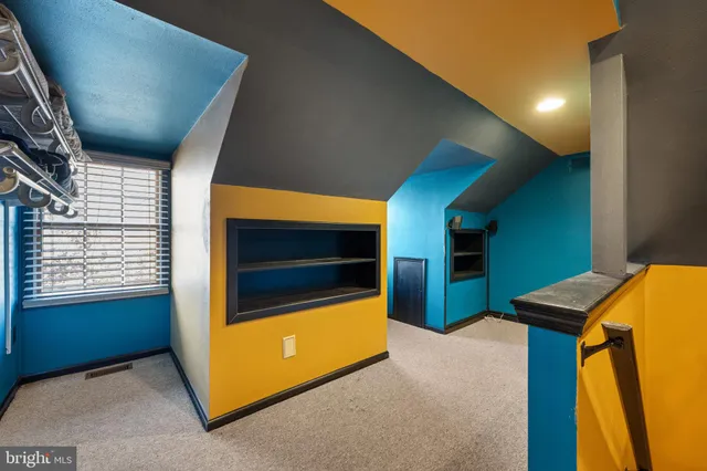 a bedroom with a bed and furniture